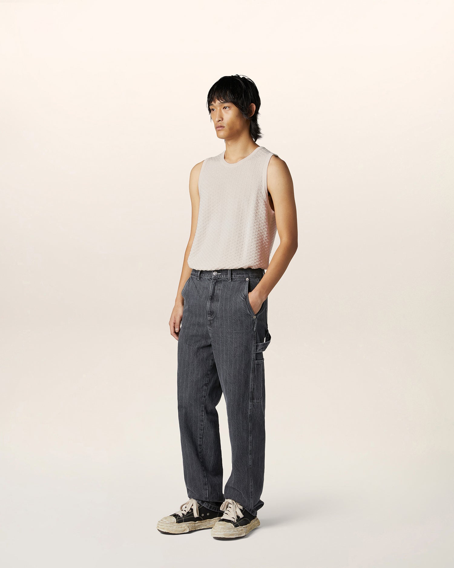 Luxury streetwear sleeveless vest crafted from Italian fabric with textured knit — contemporary menswear layering piece.